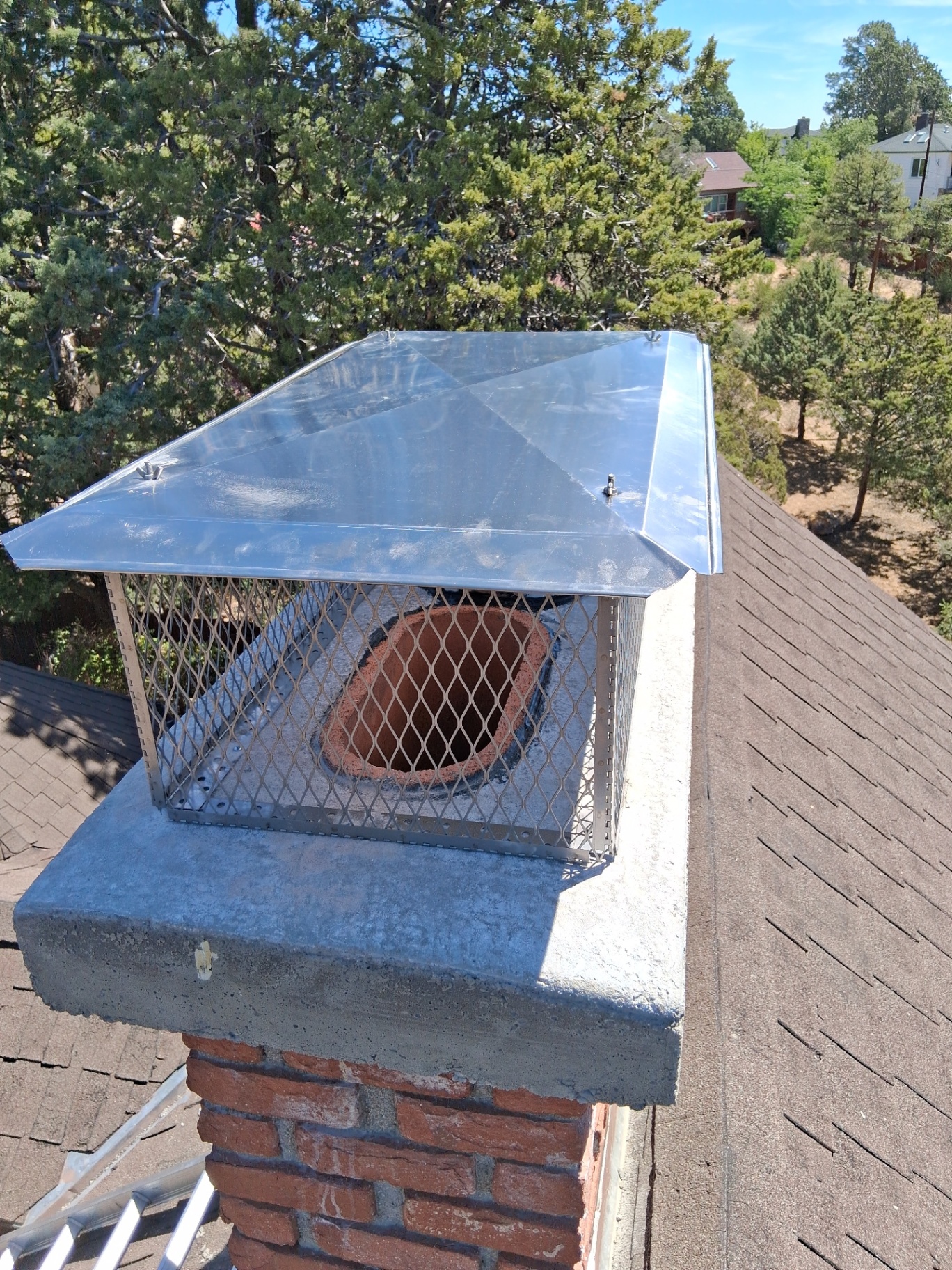 New stainless steel chimney cap and freshly sealed crown in Prescott AZ