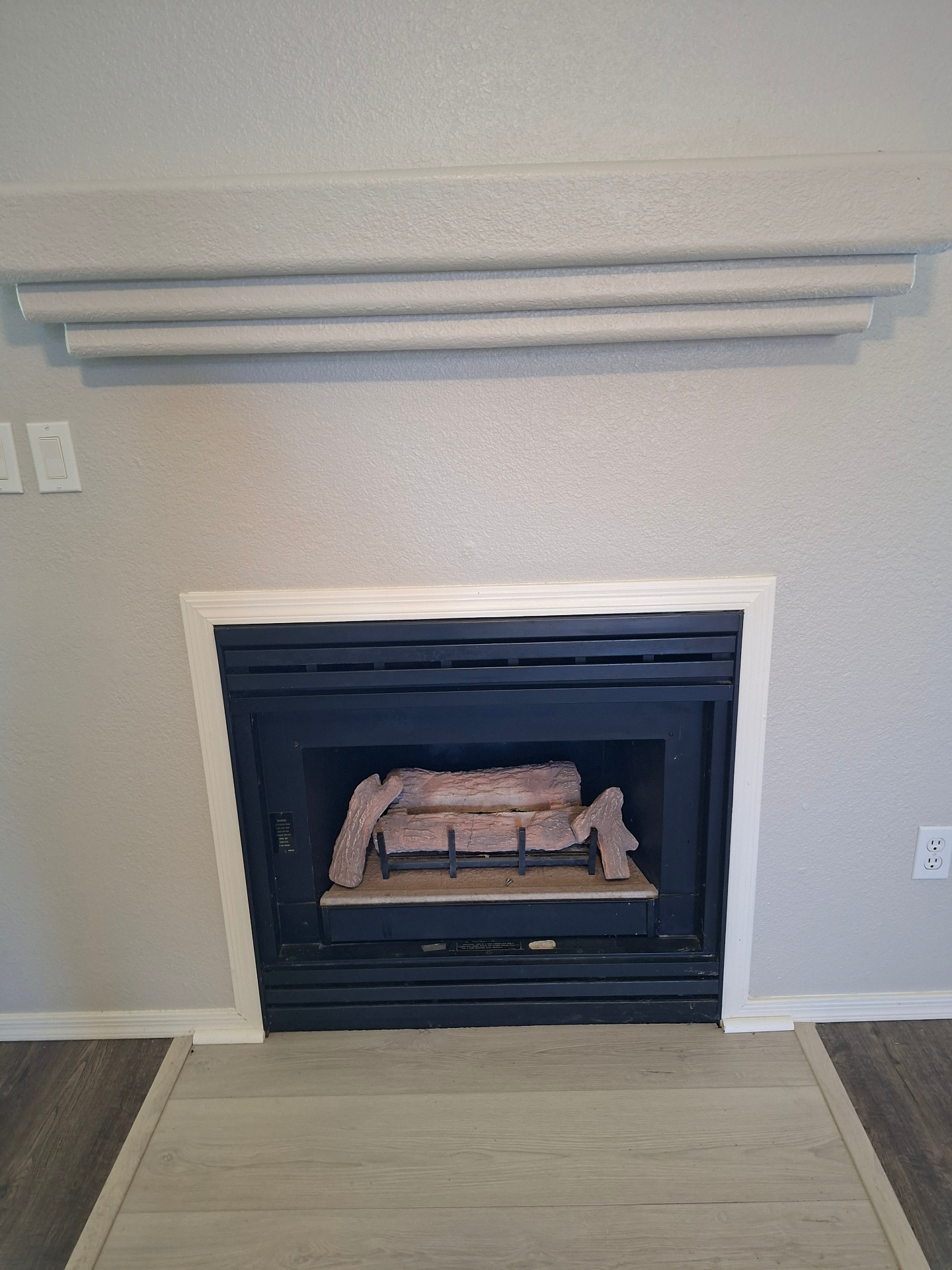 Old gas fireplace before replacement in a Prescott AZ home
